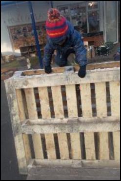 Child climbing pallet crate