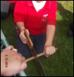 Child sawing wood